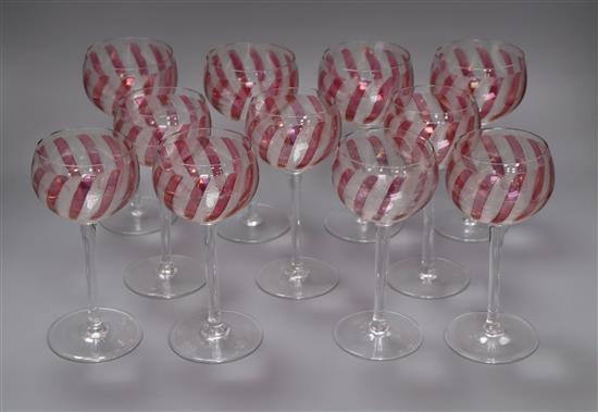 A set of eleven cranberry and etched wine glasses